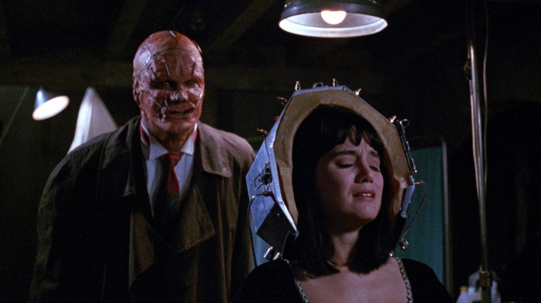 An evil killer trying to make a mask of Maggie in Popcorn