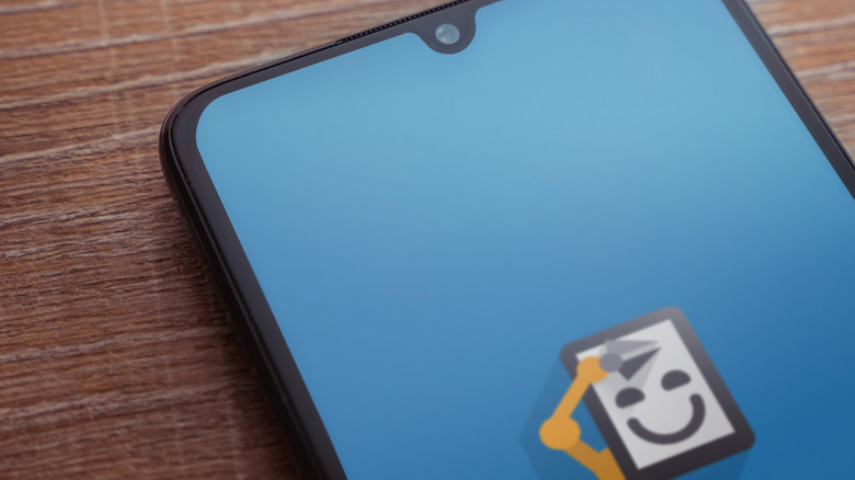 Android phone with the Automate application and logo on screen