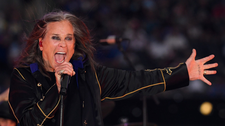 Ozzy Osbourne on stage with microphone