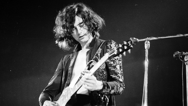 Jimmy Page with guitar on stage