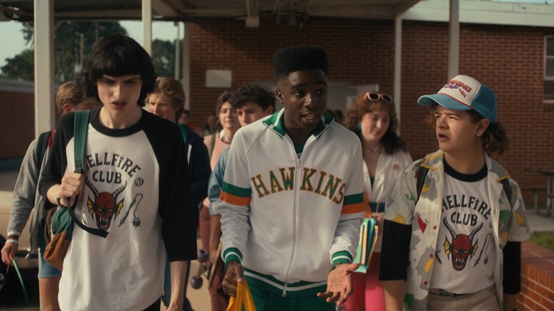 Mike, Lucas, and Dustin walking out of school in 