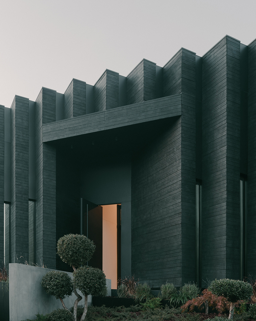 serrated charred wood shell encloses suburban residence on the hills of tbilisi