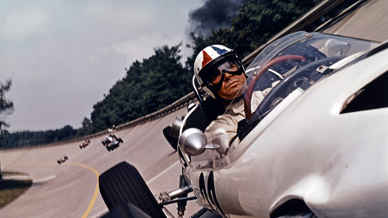 James Garner races in a scene from the film 'Grand Prix', 1966.