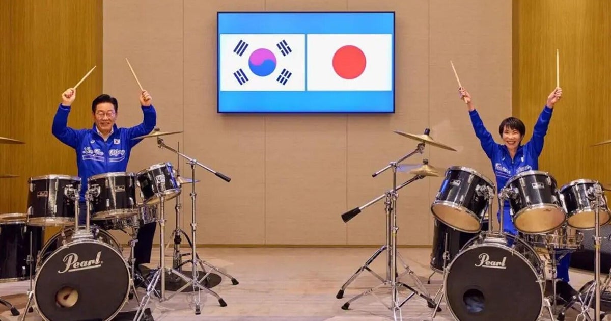 Japanese and South Korean leaders bang out surprise K-pop drum duet