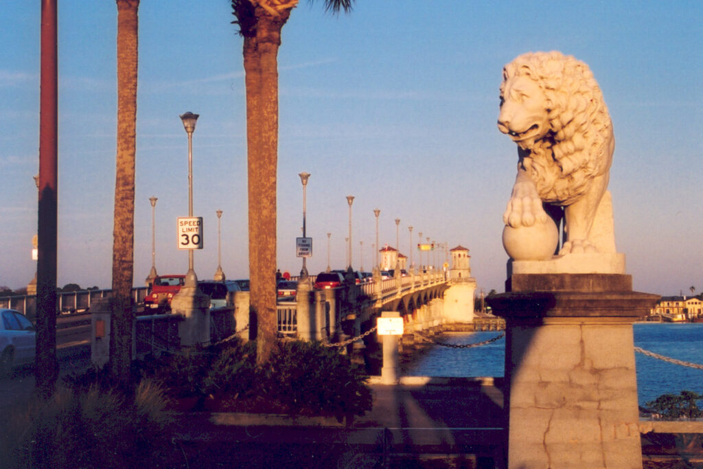 Old picture of man with lion statues