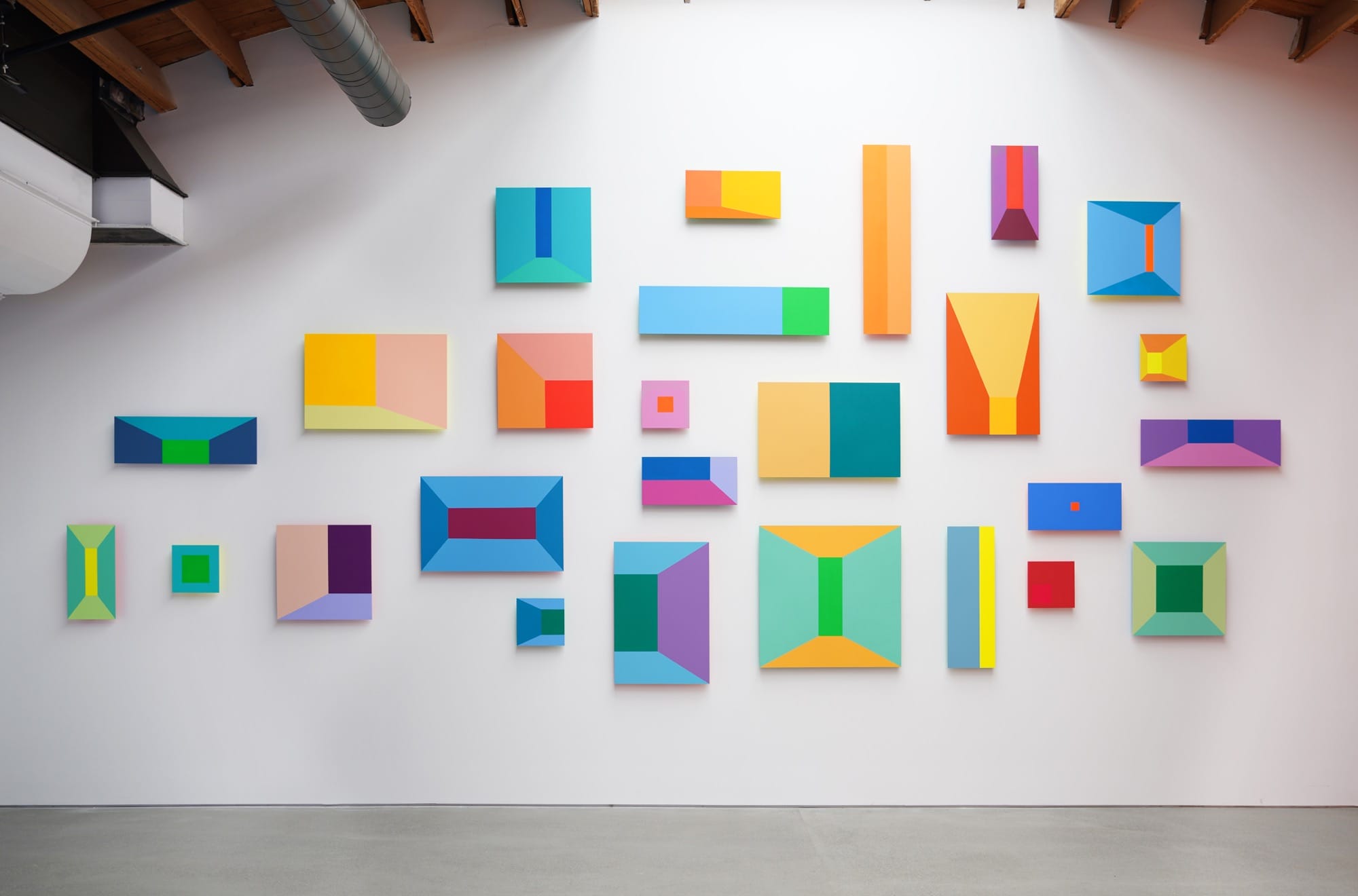 colorful rectangular shapes on a white backdrop by Luftwerk