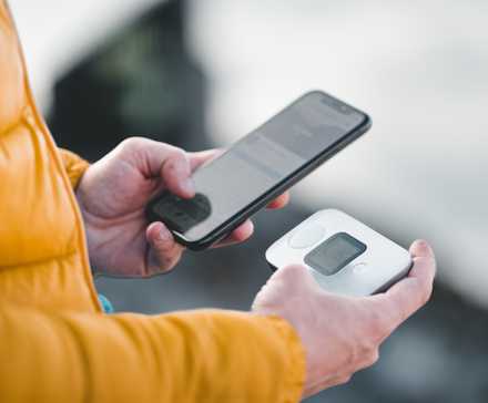 man connecting to mobile hotspot with smartphone.