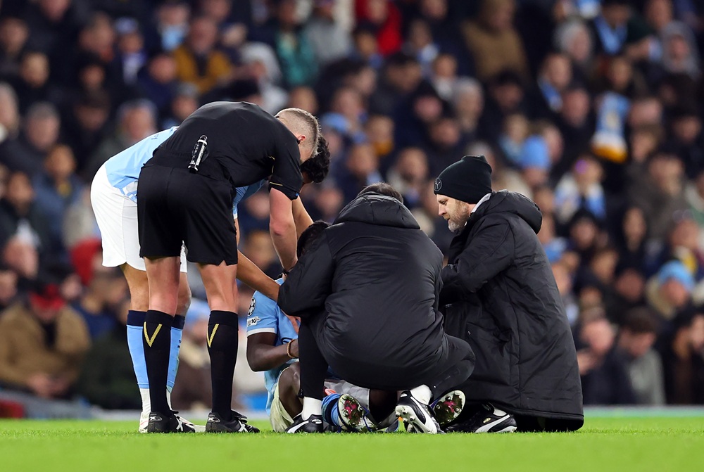 Jeremy Doku of Manchester City receives medical treatment during the UEFA Champions League 2025/26 League Phase MD8 match between Manchester City a...