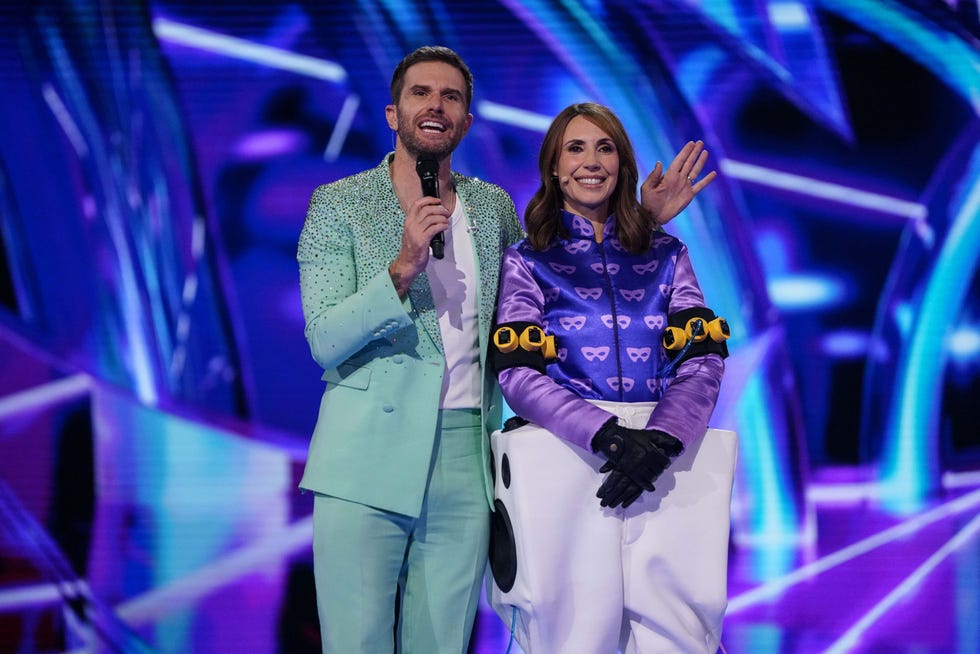 masked singer uk joel dommett alex jones two individuals on a stage engaging with an audience