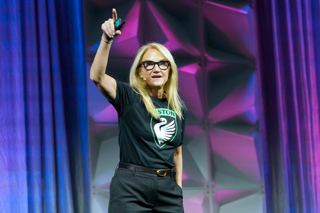 Mel Robbins speaking on stage at the Massachusetts Conference for Women.