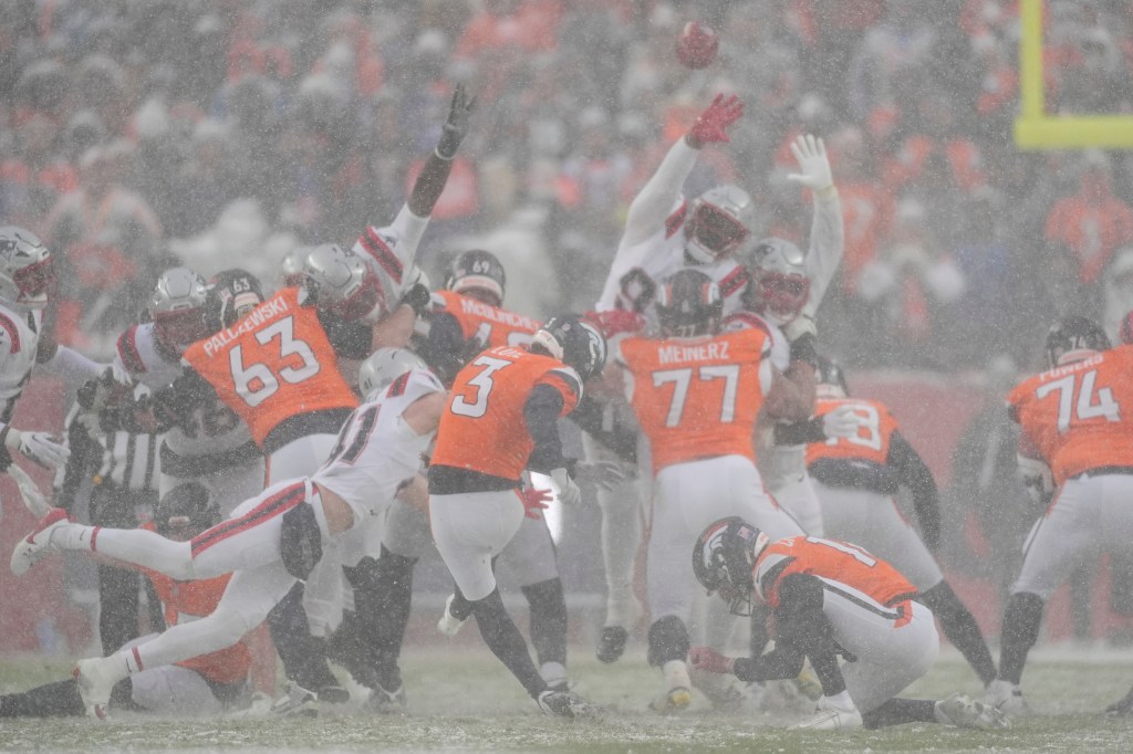 Denver Broncos kicker Wil Lutz (3) misses a field goal attempt against the New England Patriots during a snowy game.