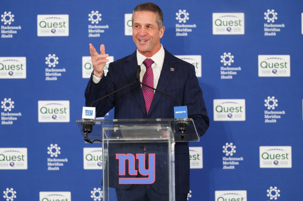 New York Giants head coach John Harbaugh speaks at a press conference.