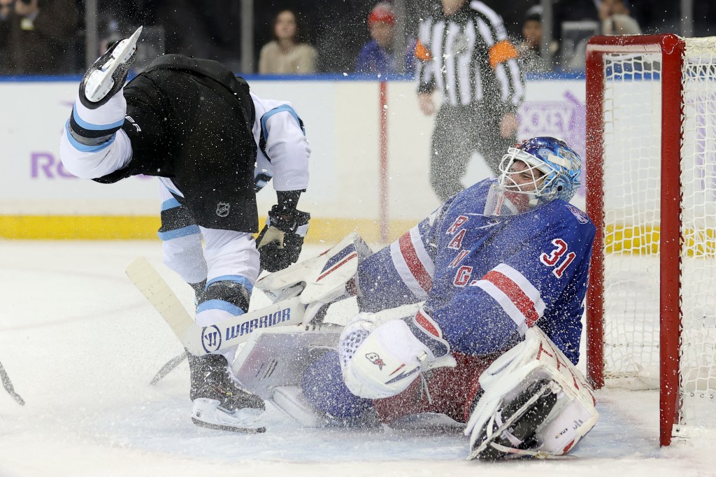 New York Rangers goaltender Igor Shesterkin (31) reacting to being skated into by Utah Mammoth right wing JJ Peterka (77).