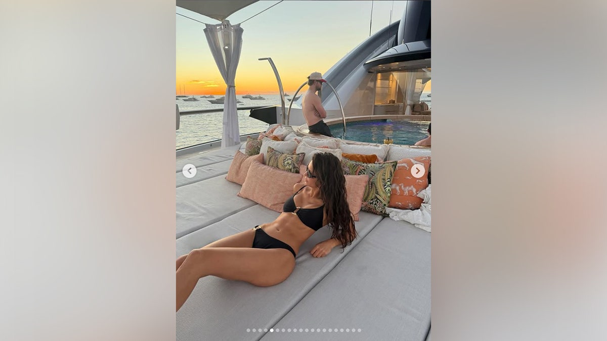 Another shot features Nina Dobrev in a black bikini on a yacht.