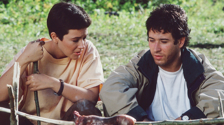 Janine Turner as Maggie O'Connell sits next to Rob Morrow as Joel Fleischman in Northern Exposure
