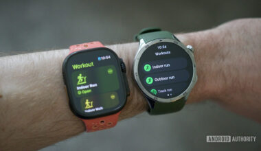 Someone wearing an Apple Watch Ultra 2 and OnePlus Watch 3.