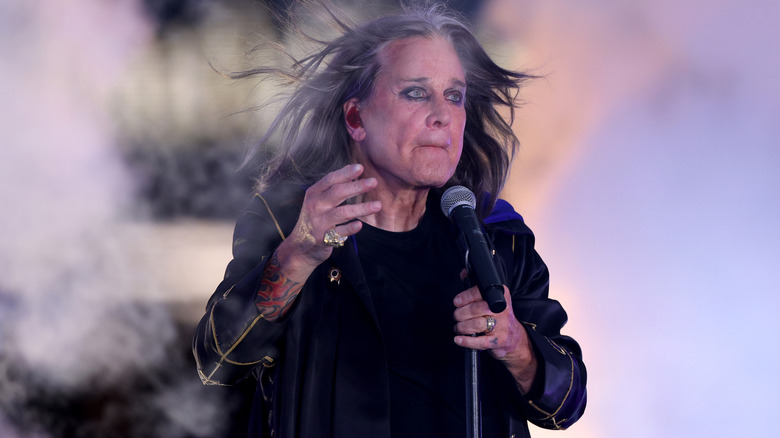 Ozzy Osbourne singing on stage in 2022
