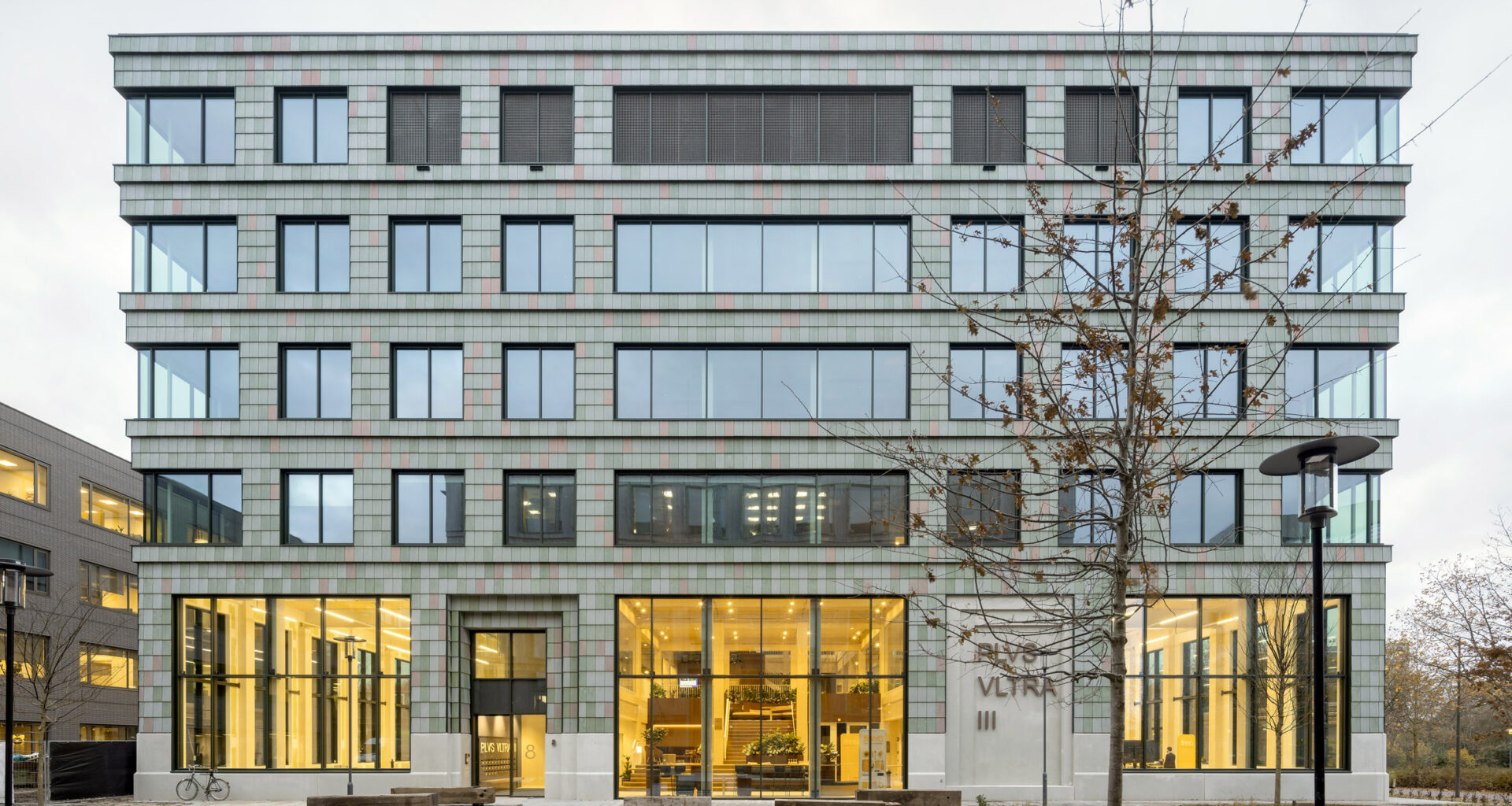 Building clad in plastic tiles