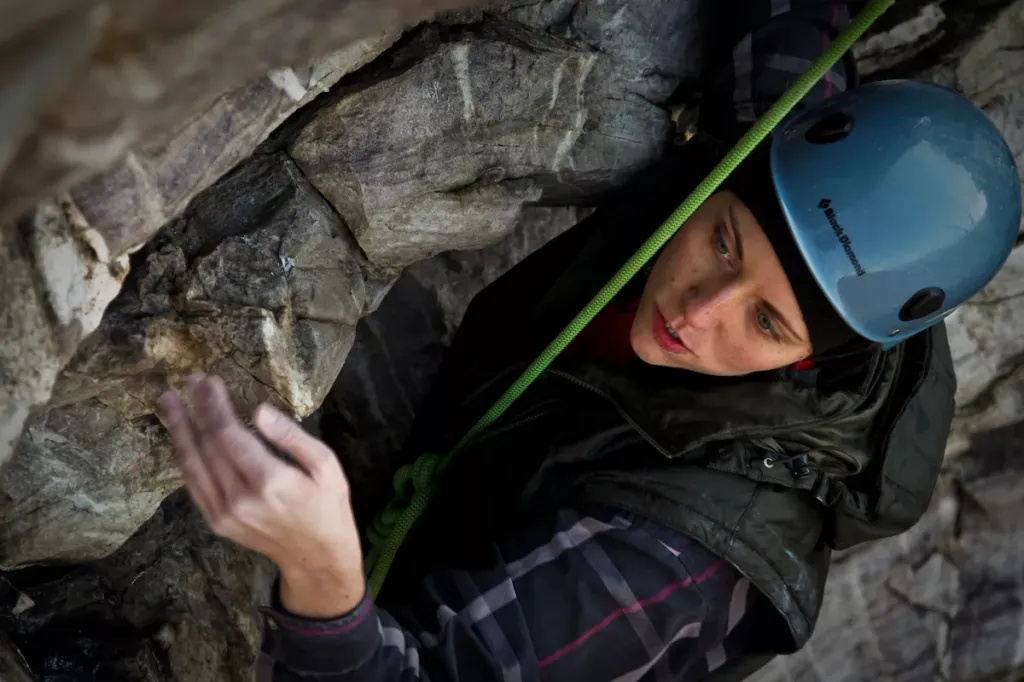 photo of a woman rock climbing