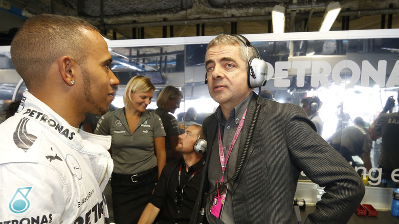 Motorsports: FIA Formula One World Championship 2013, Grand Prix of Italy, #10 Lewis Hamilton (GBR, Mercedes AMG Petronas F1 Team), Rowan Atkinson (GBR, Actor)
