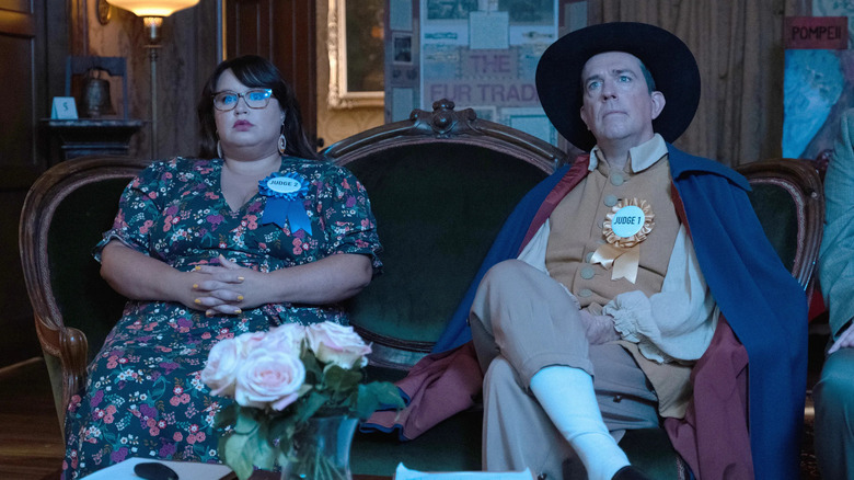 Reagan (Jana Schmieding) and Nathan (Ed Helms) watch TV in Rutherford Falls