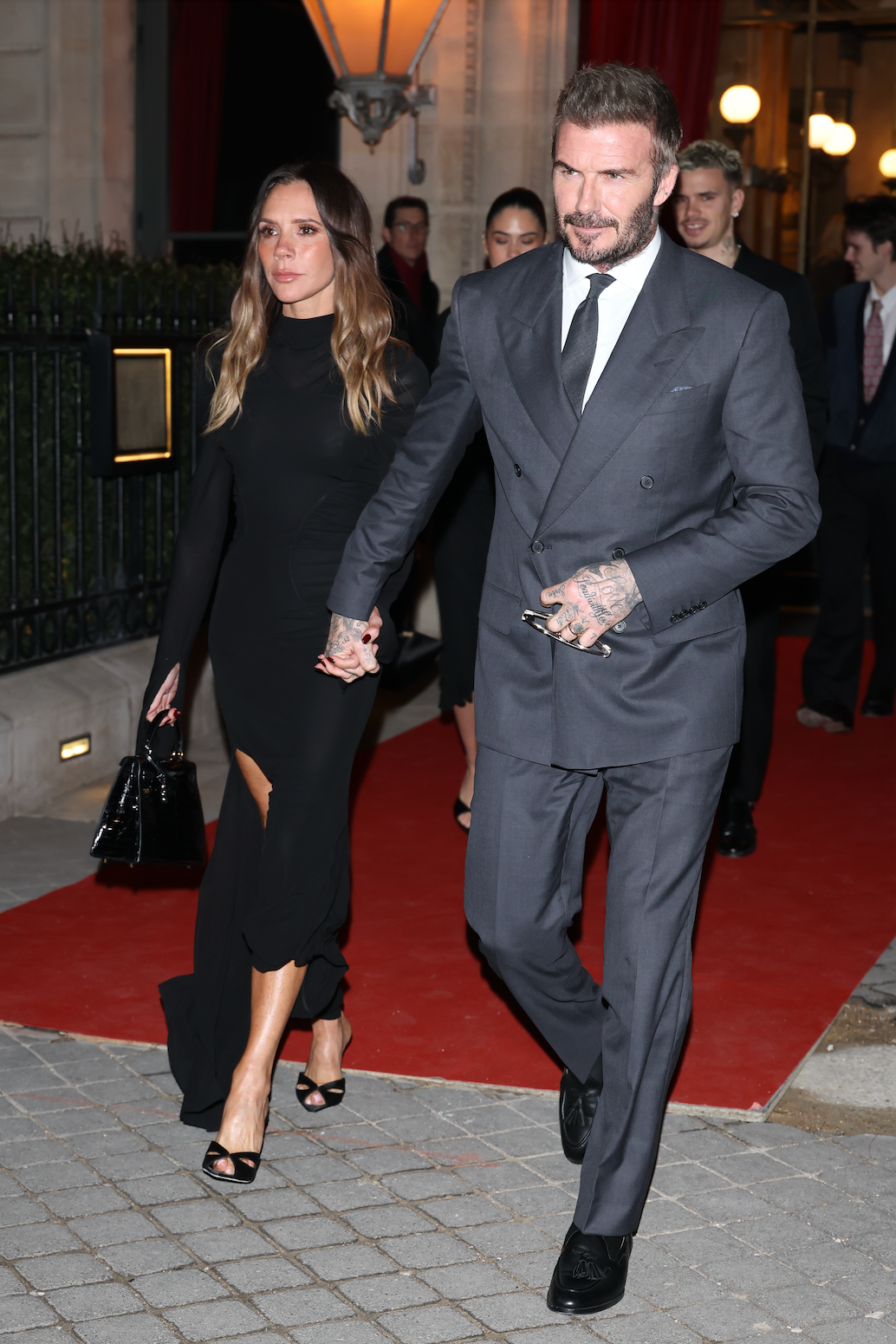 couple walking on a red carpet