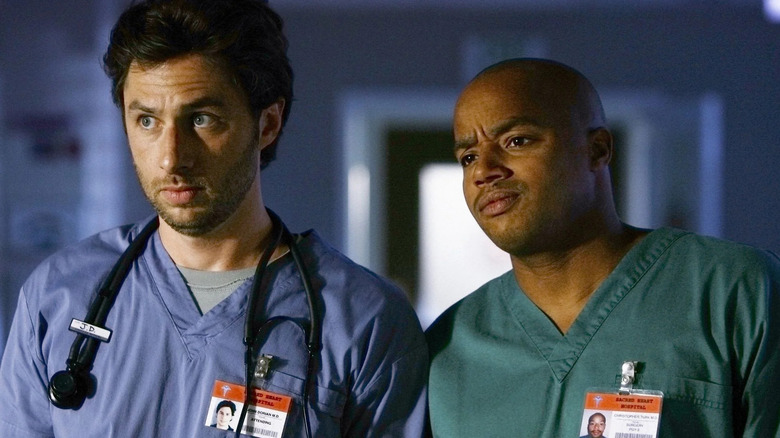 Zach Braff as JD Dorian stands next to Donald Faison as Dr. Christopher Turk in Scrubs