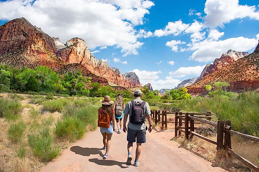 Tourists walking on a trail in the Zion National Park, Utah.