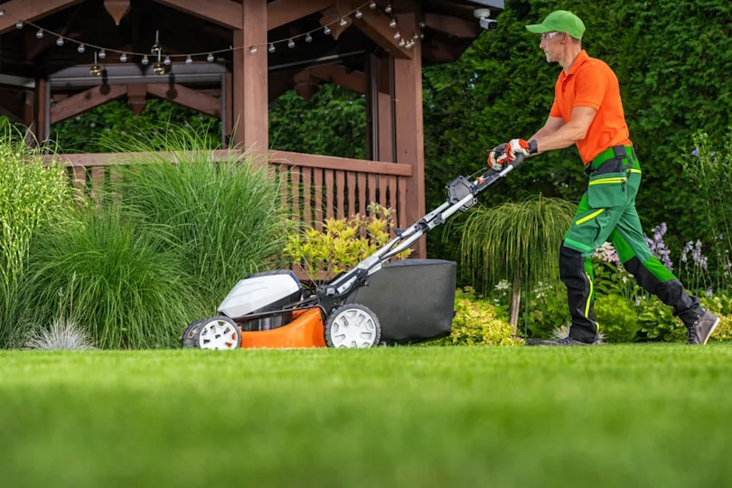 gardener mowing the lawn