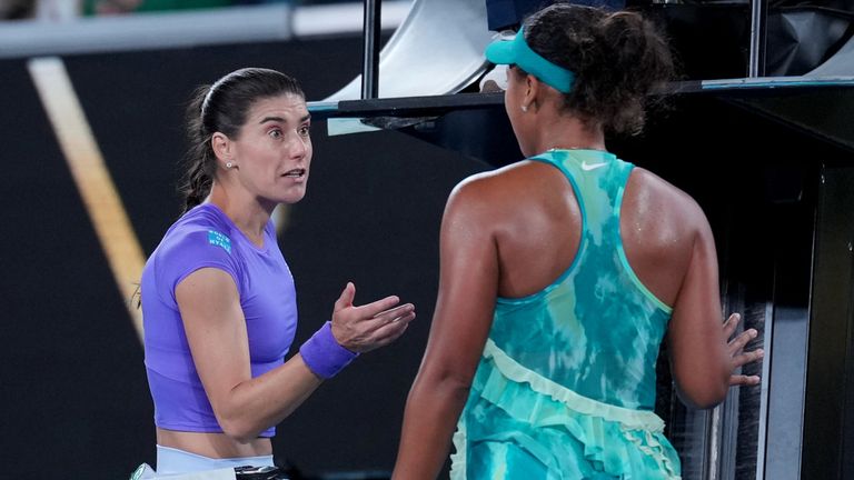 Naomi Osaka, right, of Japan talks with Sorana Cirstea, left, of Romania following their second round match at the Australian Open tennis ch