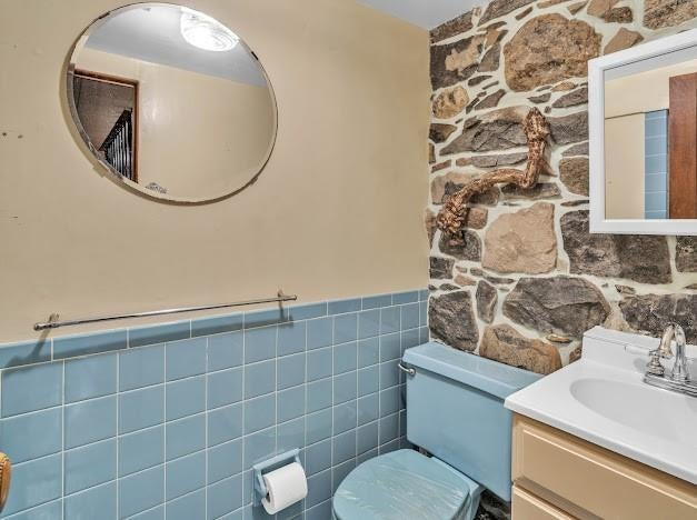 bathroom with blue tile and toilet