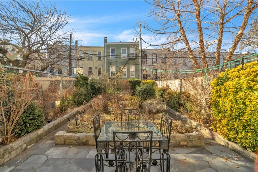 garden with stone paths around central planting bed