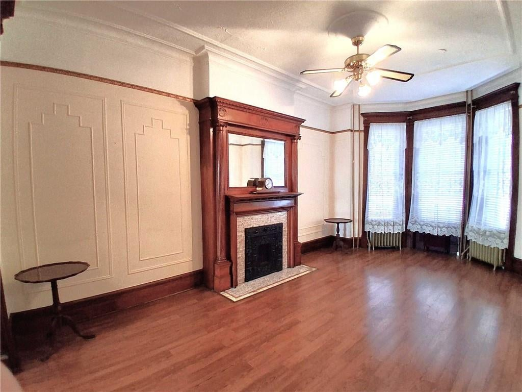 parlor with mantel, wall moldings