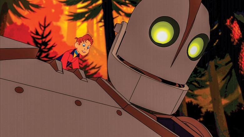 Hogarth Hughes sitting on the Iron Giant's shoulder in "The Iron Giant"