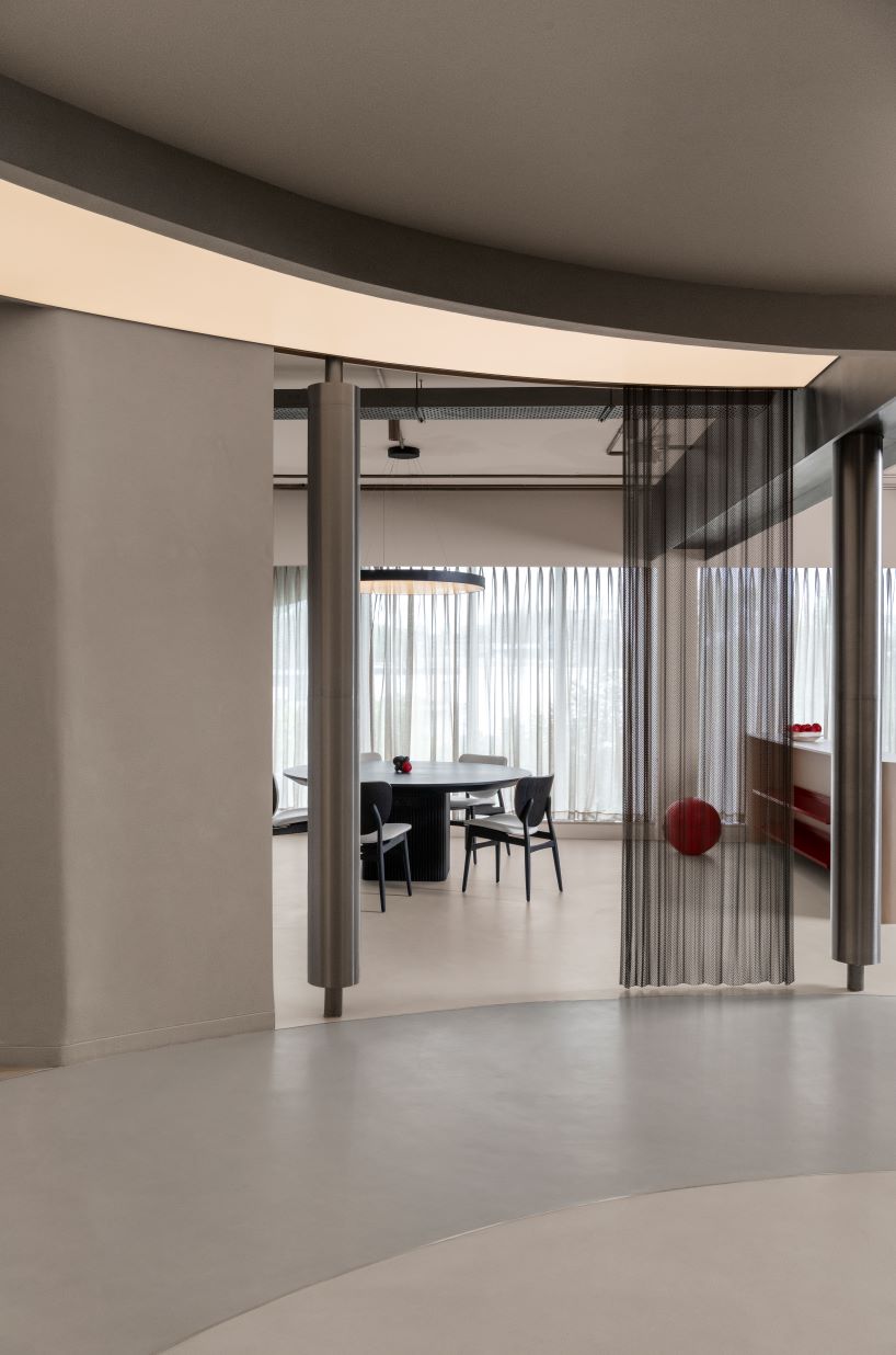 concrete and steel textures shape showroom in india organized as a continuous loop