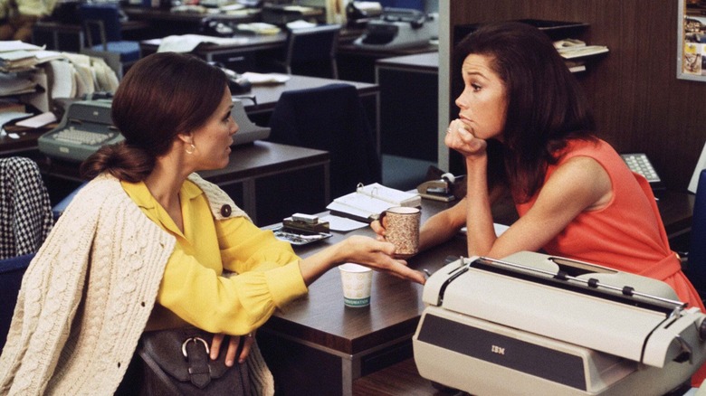 Rhoda talking to Mary with concern at her desk