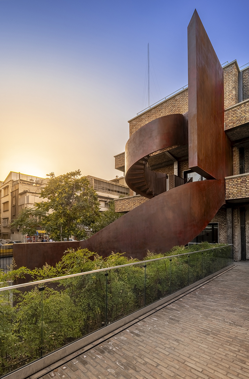 sculptural steel staircase and wall breathes new life into iranian poet’s 1970s home