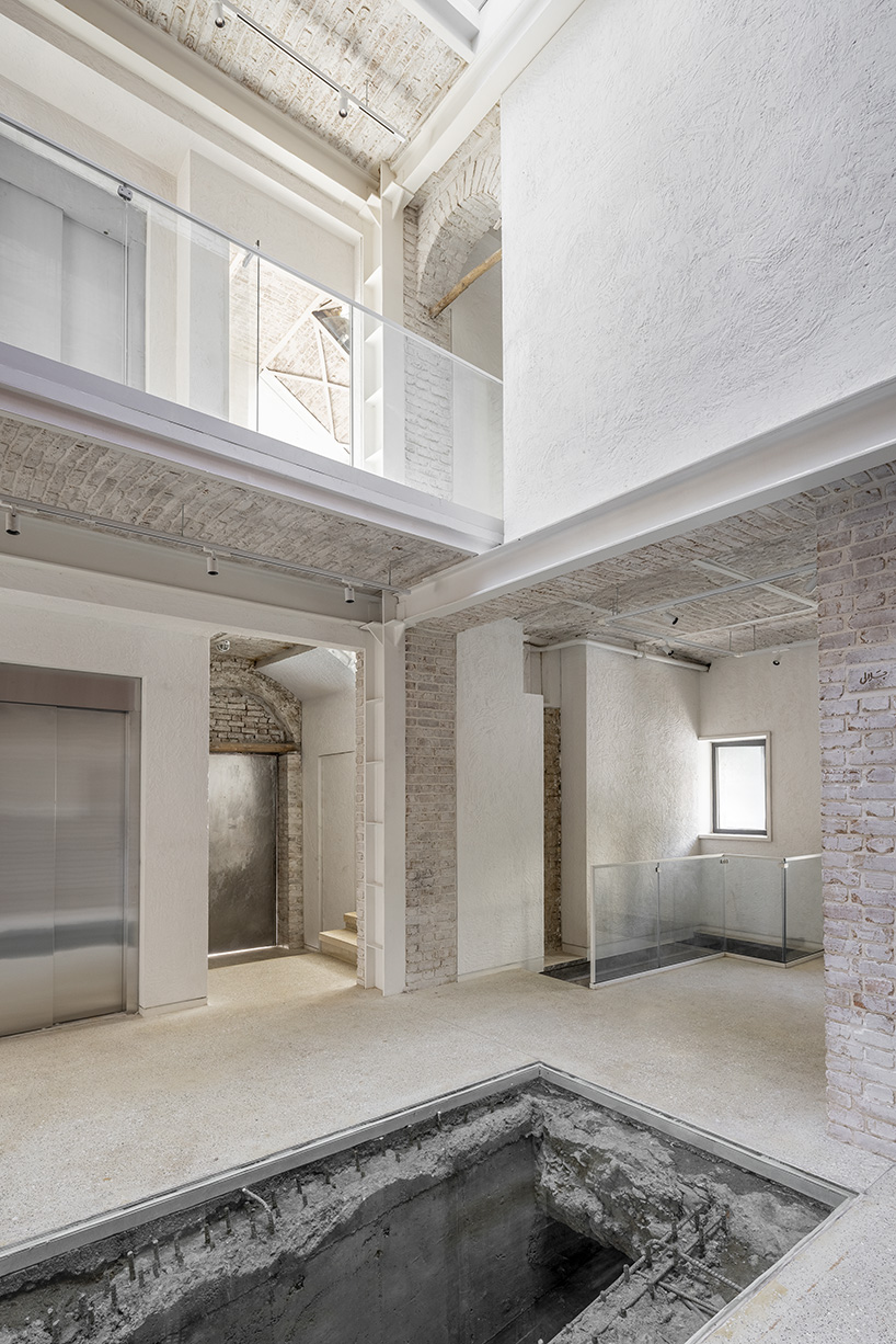 sculptural steel staircase and wall breathes new life into iranian poet’s 1970s home