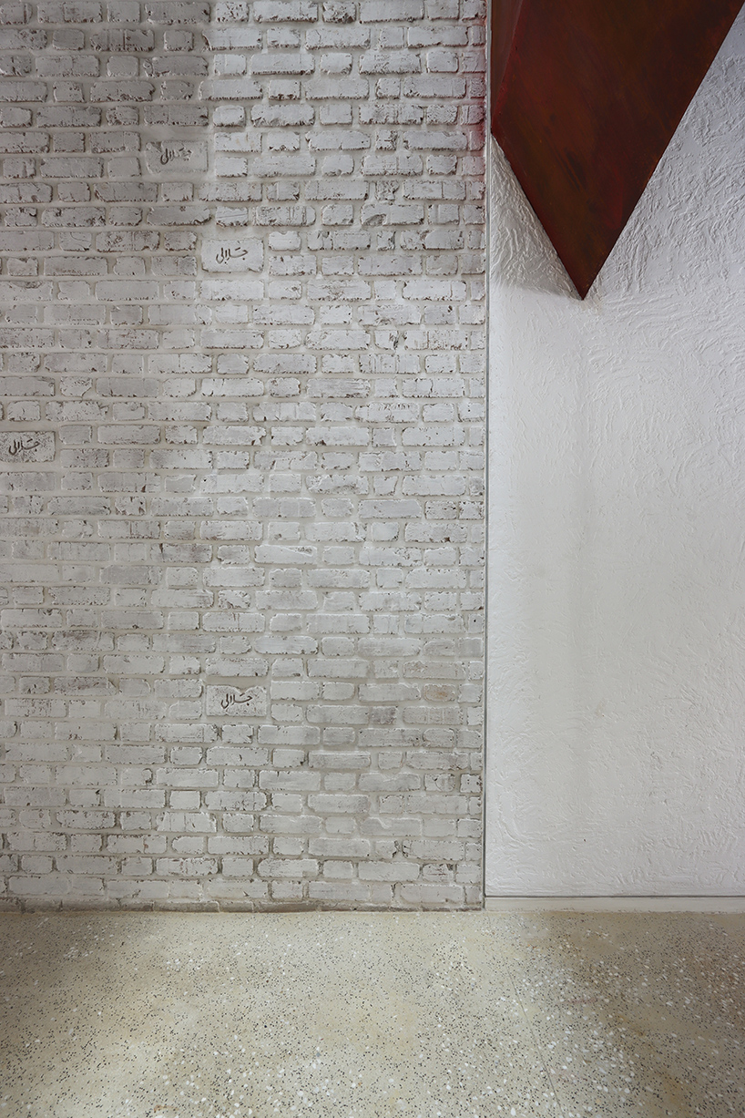 sculptural steel staircase and wall breathes new life into iranian poet’s 1970s home
