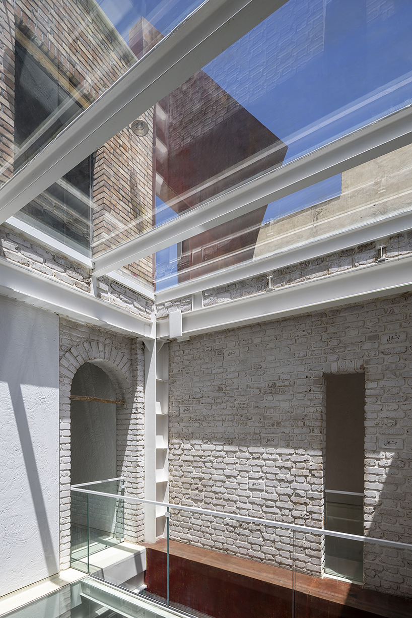 sculptural steel staircase and wall breathes new life into iranian poet’s 1970s home