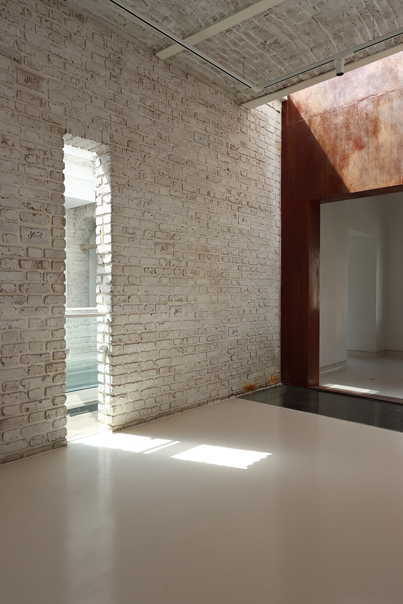 sculptural steel staircase and wall breathes new life into iranian poet’s 1970s home