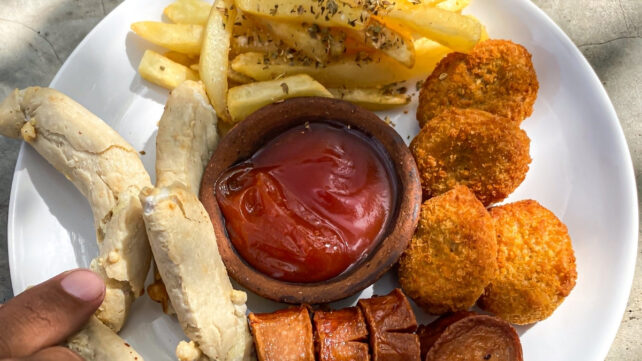 Chicken nuggets and french fries, ketchup and mayonnaise sauces. Concept for junk food, unhealthy