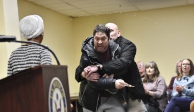 Rep. Ilhan Omar rushed by man on stage and sprayed with liquid at town hall event : NPR