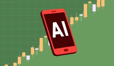 Smartphone displaying AI with a green stock chart behind.