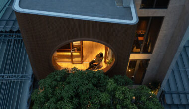 vespa-inspired curved geometry shapes vietnam residence clad in wood