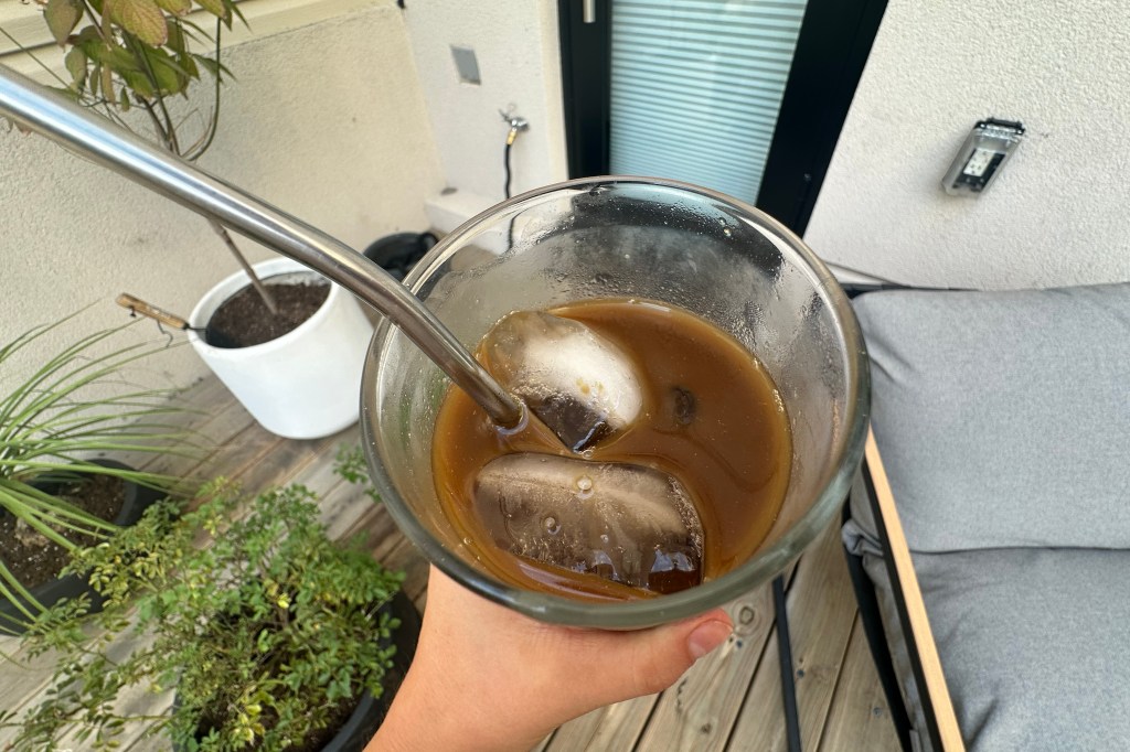 hand holding a glass of AGZ