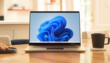 A laptop PC running Windows 11 sitting next to a coffee mug.