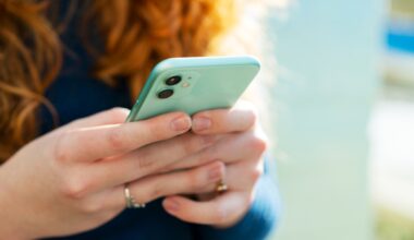 Woman holding phone. (Tim Robberts/Getty images)