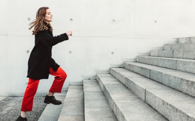 woman running up stairs