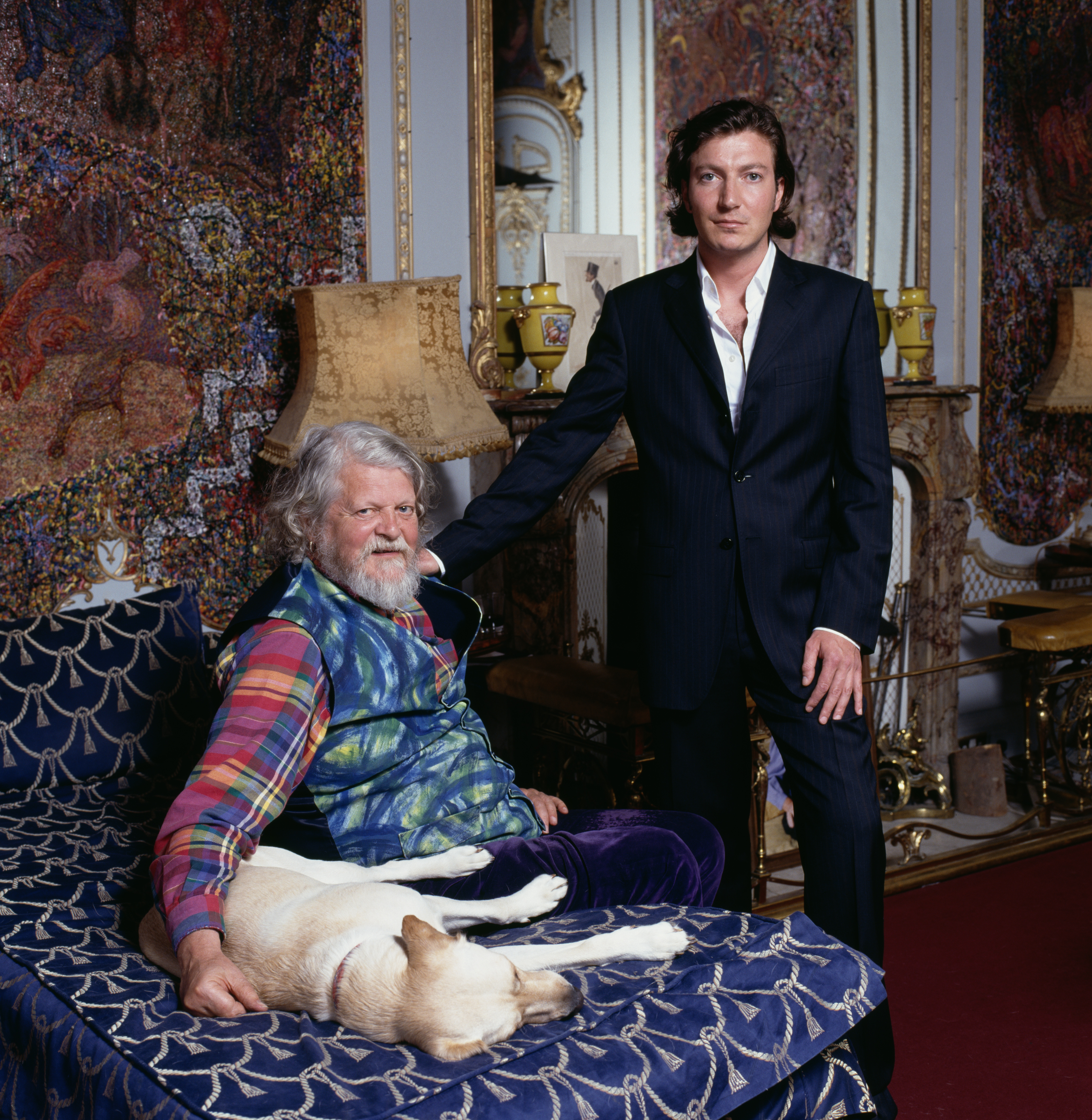 Lord Bath and his son, Viscount Weymouth, at Longleat with a dog.